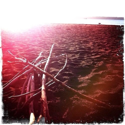 DIY Bohemian Beach Tent: Effortless Sun Protection with Poles and Old Sheets