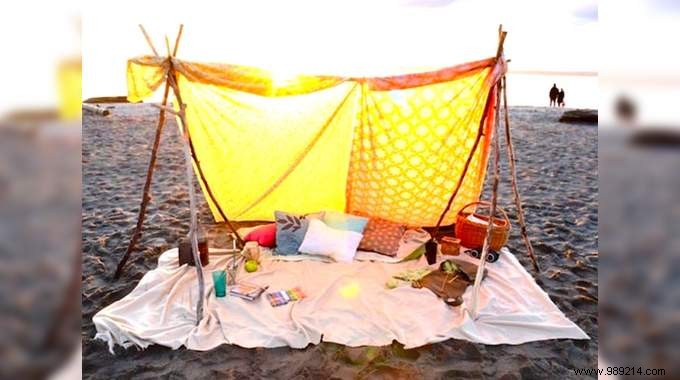 DIY Bohemian Beach Tent: Effortless Sun Protection with Poles and Old Sheets