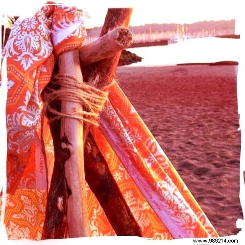 DIY Bohemian Beach Tent: Effortless Sun Protection with Poles and Old Sheets