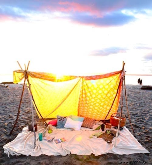 DIY Bohemian Beach Tent: Effortless Sun Protection with Poles and Old Sheets