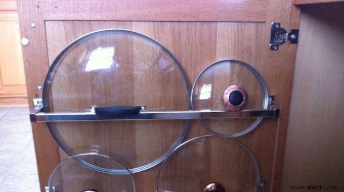 The Smartest Way to Organize Pot and Pan Lids: A Towel Rack Cabinet Hack