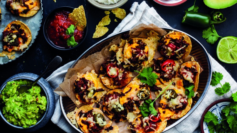 Authentic Tex-Mex Nacho Platter: Seasoned Ground Beef, Melted Cheese & Fresh Guacamole