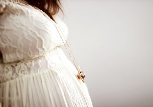 Everything You Need to Know About the Pregnancy Bola Necklace